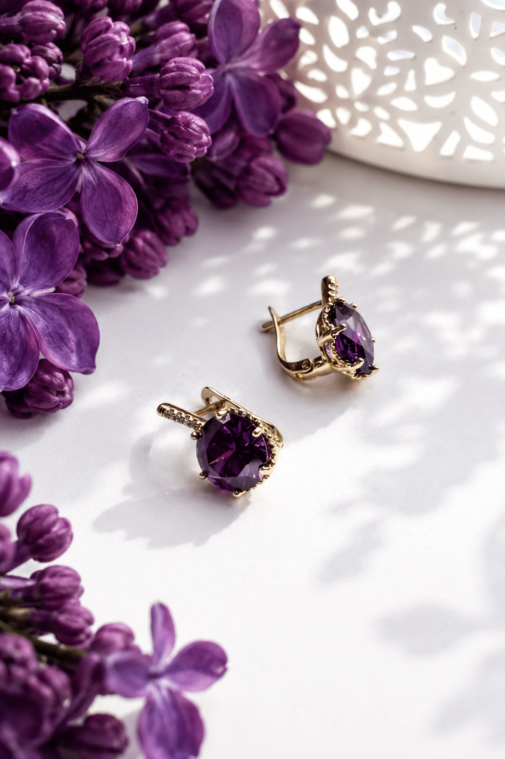 Amelia gold-colored earrings with purple zirconia and purple lilacs
