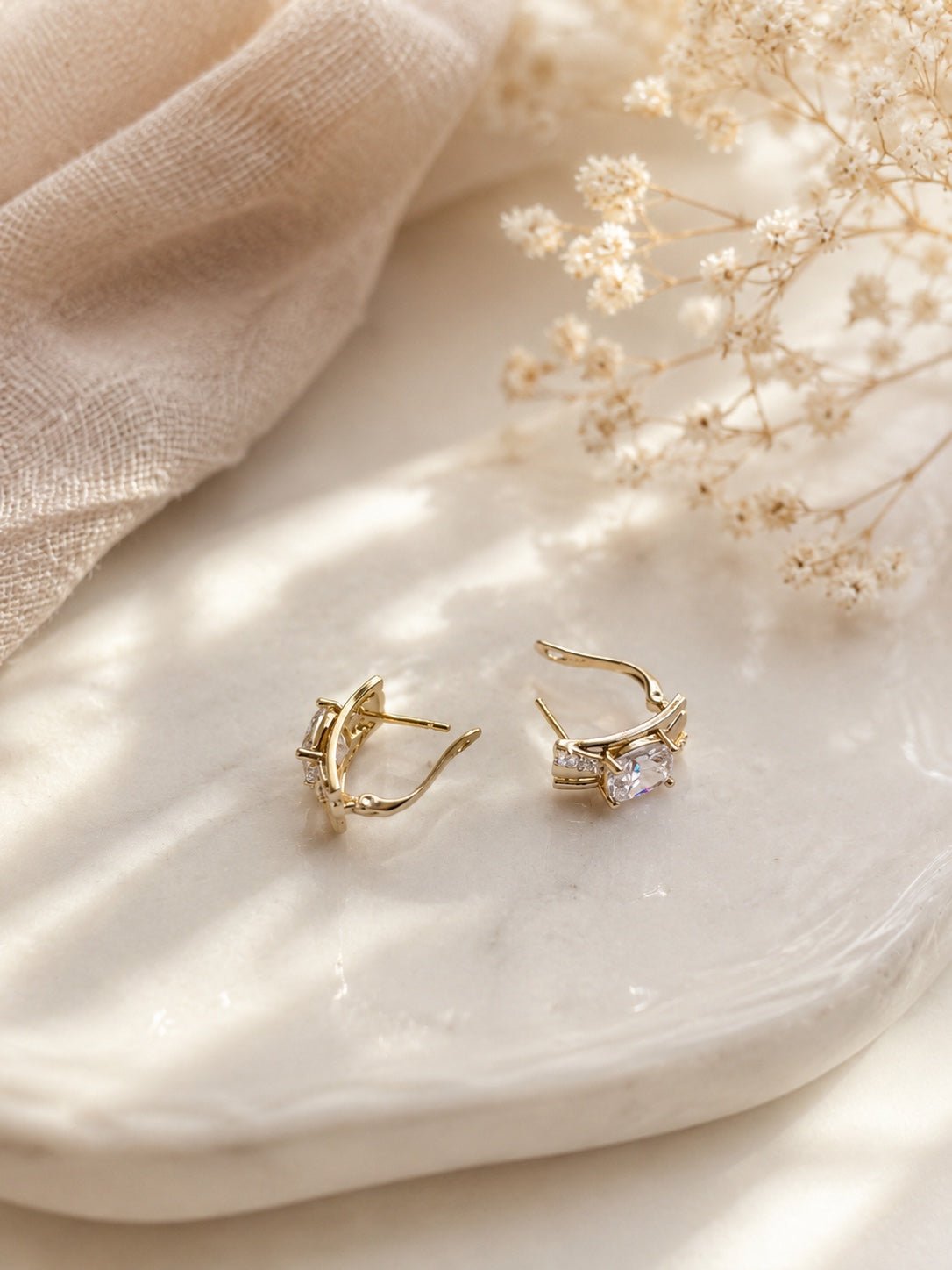 Dace 18k gold-plated moisture-resistant earrings with square cubic zirconia on a light background