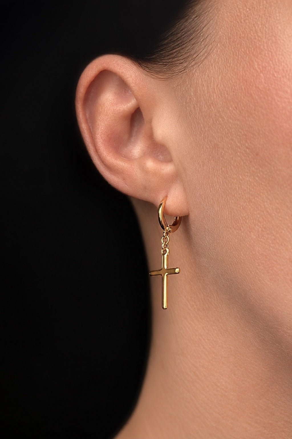 18K gold-plated hoop earrings with cross pendant on the ear