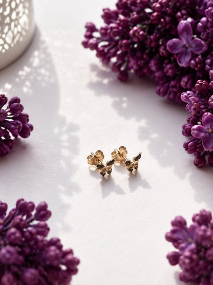 18K gold plated butterfly stud earrings with black cubic zirconias on lilac