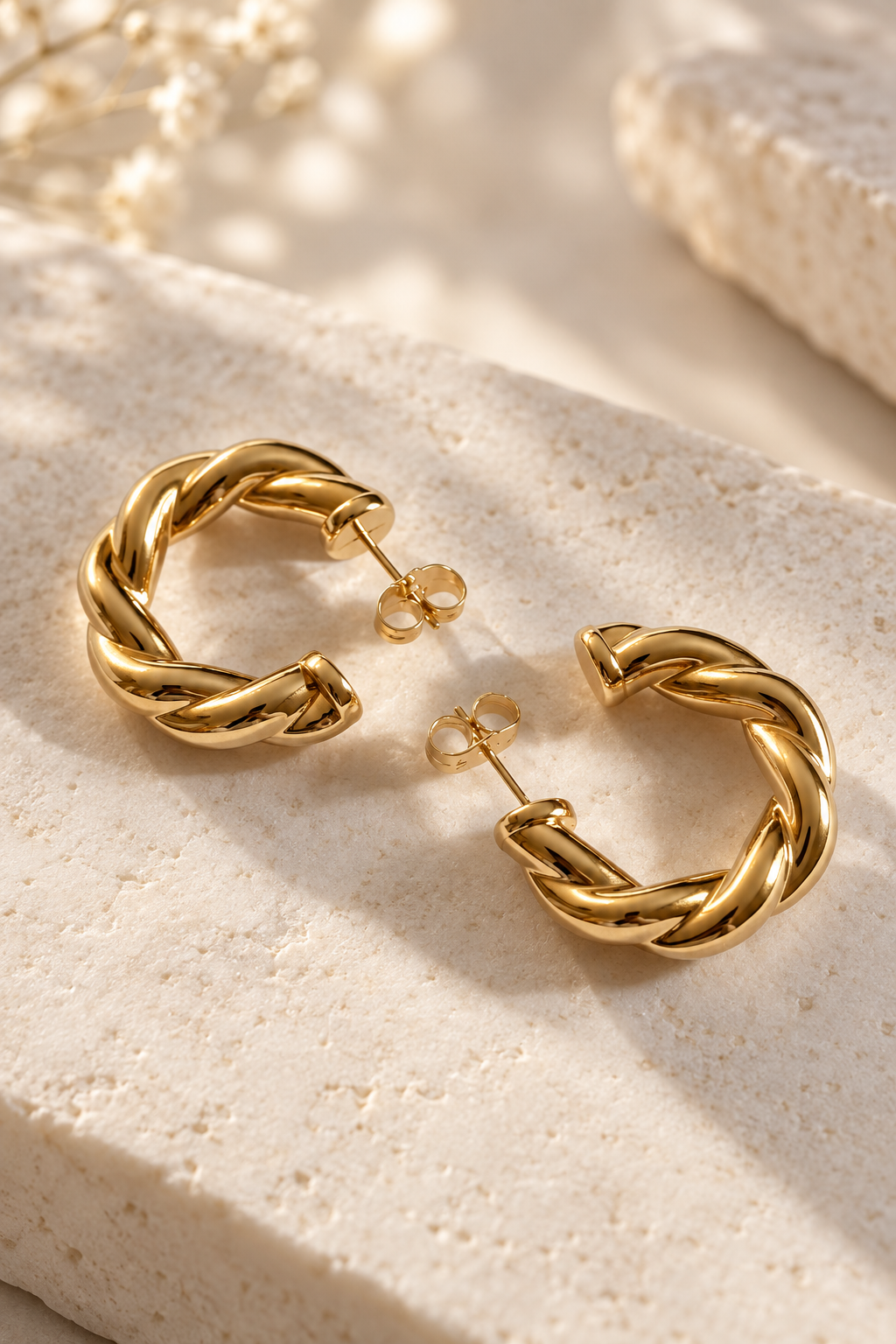 Gold-plated stud earrings with twisted pattern