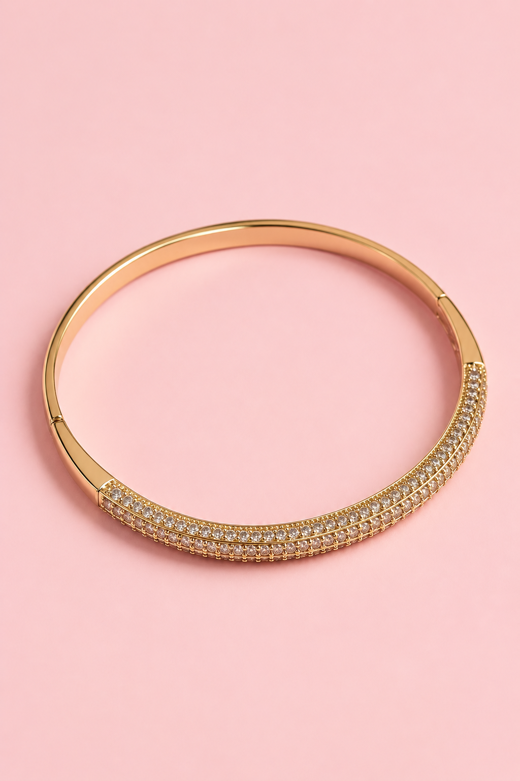 Gold-plated bangle bracelet with embedded zircons