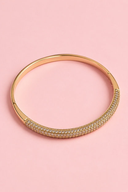 Gold-plated bangle bracelet with embedded zircons