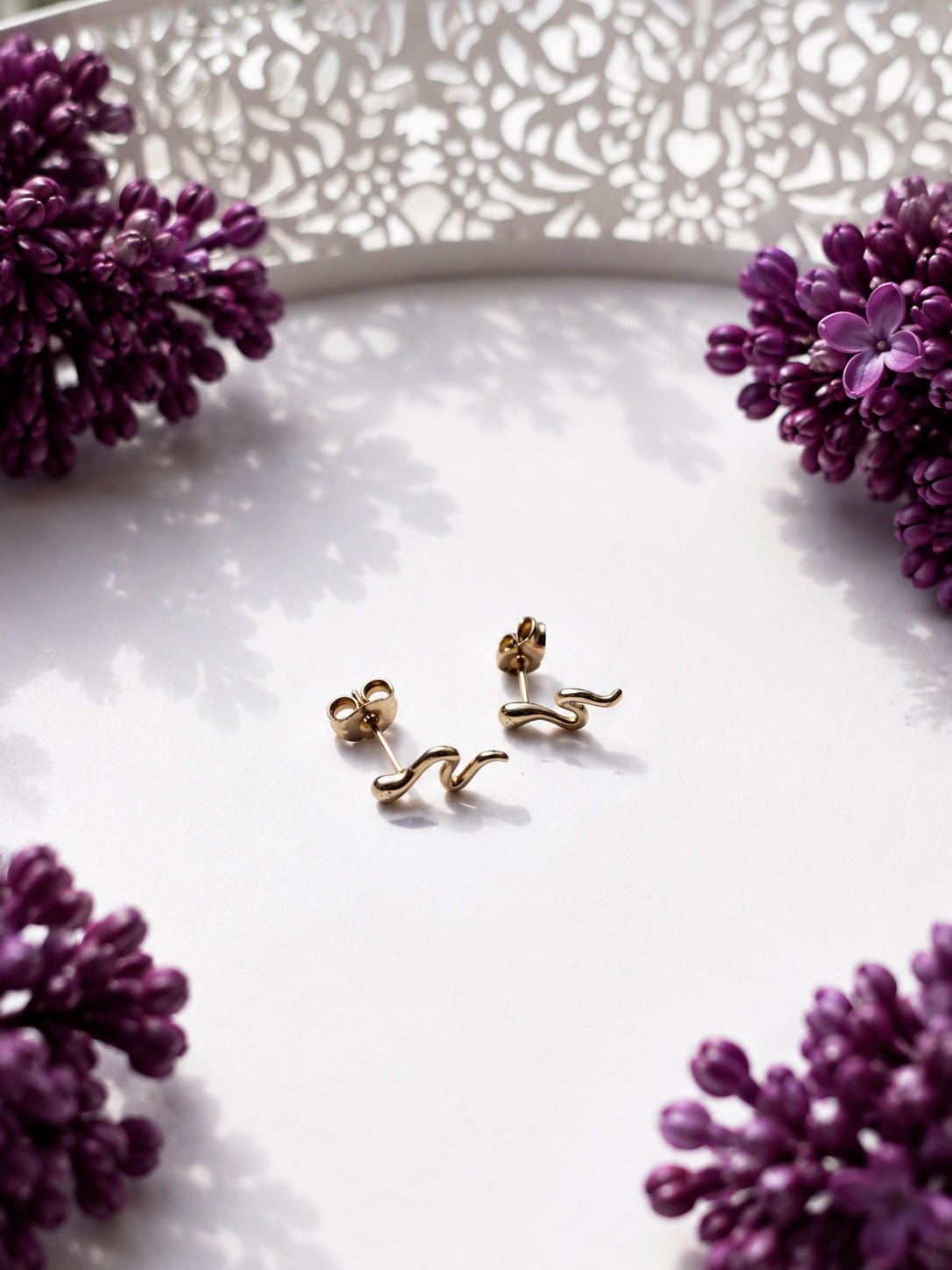 18K gold plated snake claw earrings with single cubic zirconia