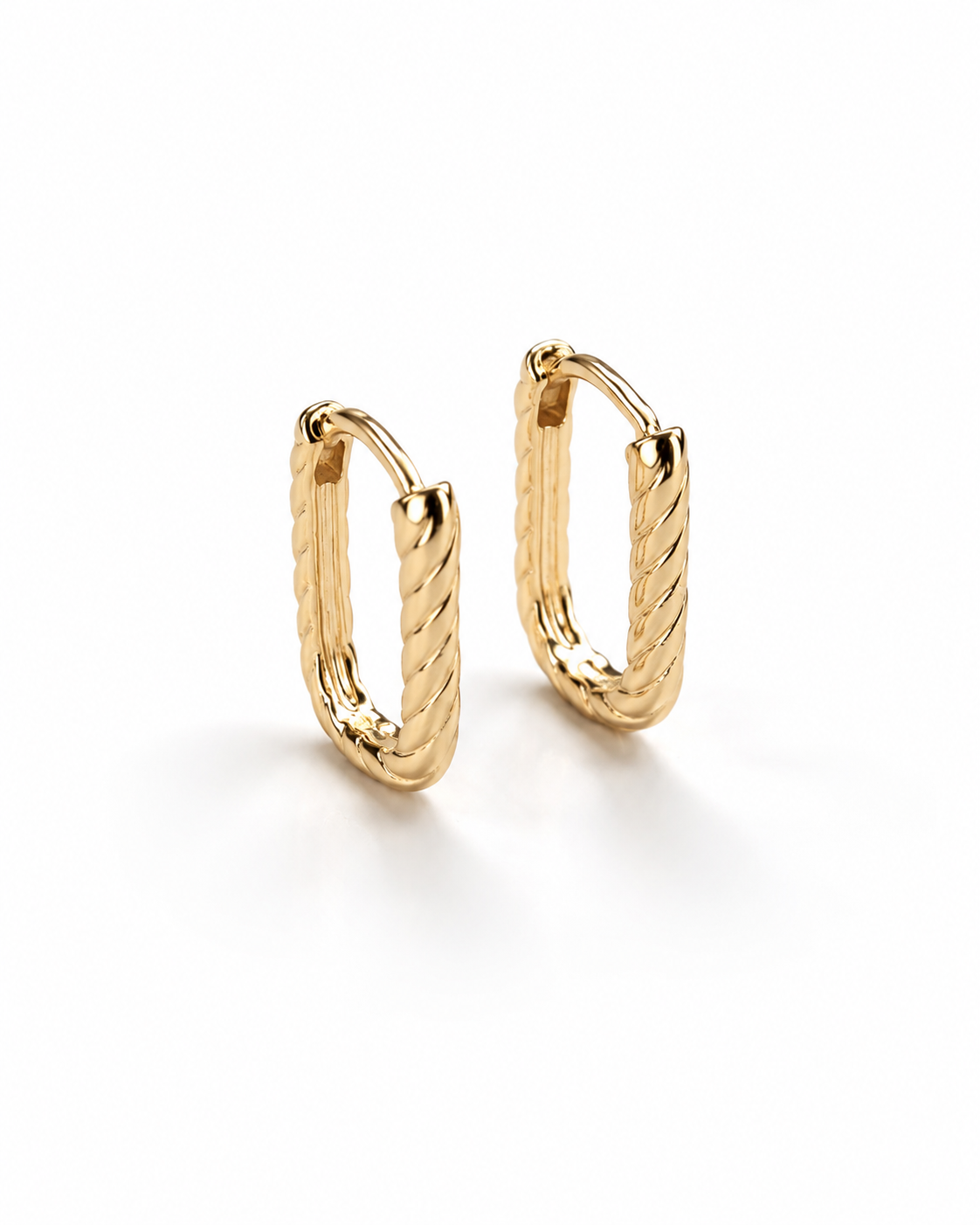 18k gold-plated twisted design oval hoop earrings on a white background