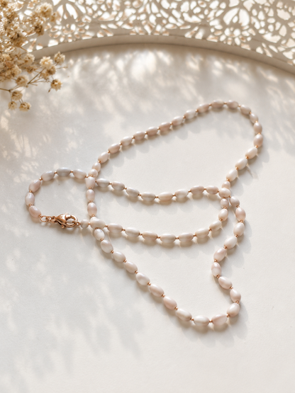 White pearl necklace 45 cm on a light background