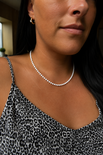 White pearl necklace on the model