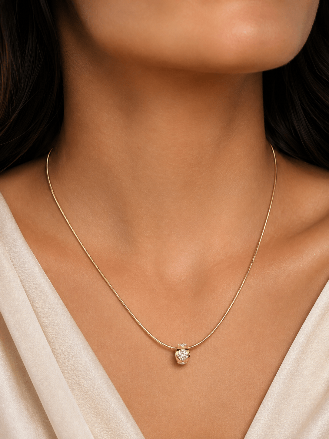 Gold-tone necklace 50 cm with zirconia pendant worn by a woman – lifestyle photo