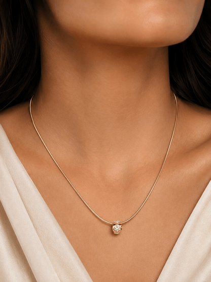 Gold-tone necklace 50 cm with zirconia pendant worn by a woman – lifestyle photo
