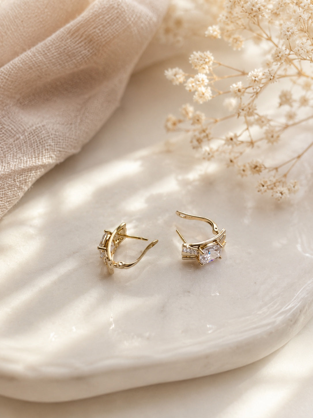 Dace 18k gold-plated moisture-resistant earrings with square cubic zirconia on a light background