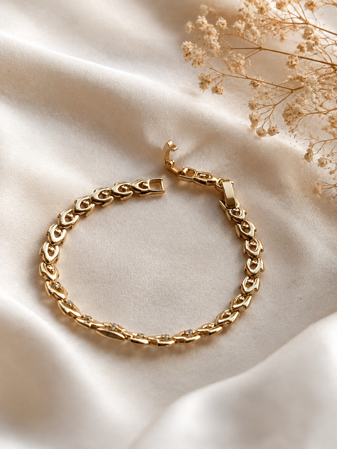 18k gold-plated bracelet with zircons on light silk fabric