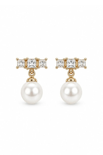 Clara stud earrings with a pearl on the model's ear