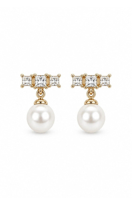 Clara stud earrings with a pearl on the model's ear