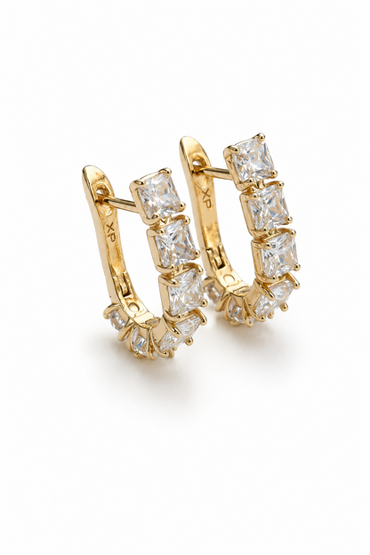 Sparkling 18k gold-plated earrings with square cubic zirconias on a white background