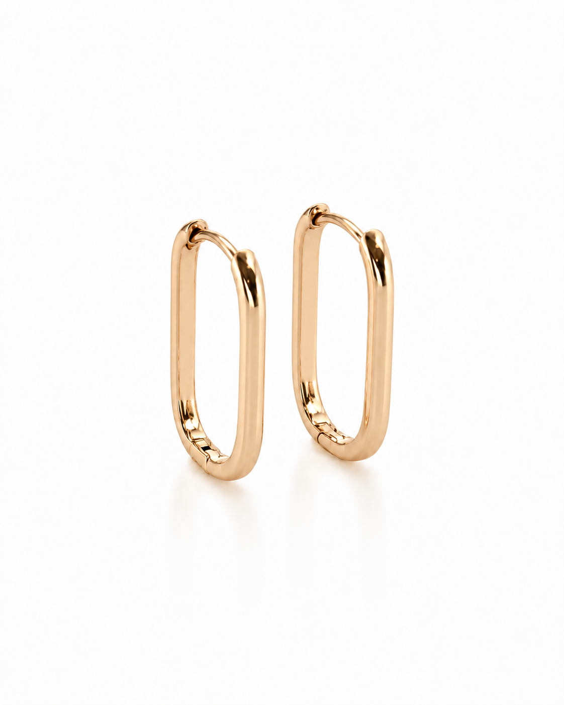 Monika – 18k gold-plated oval hoop earrings on a white background