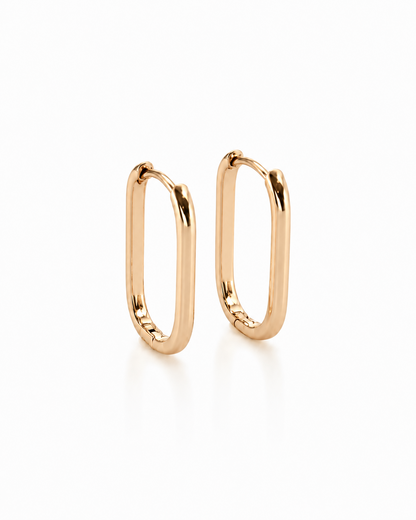 Monika – 18k gold-plated oval hoop earrings on a white background