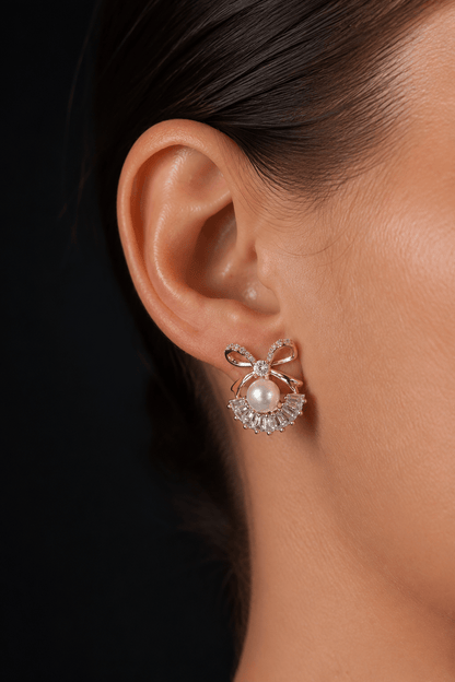 Stud earrings with pearls on the ear