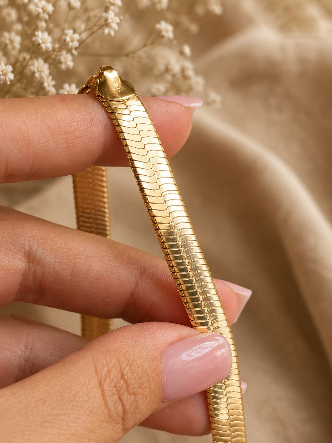 Wide gold plated flat necklace close up