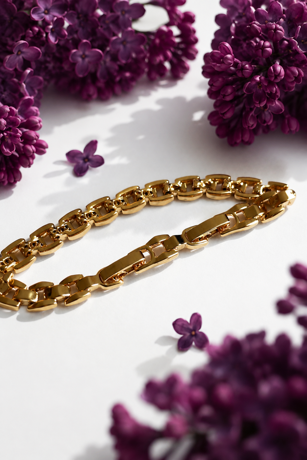 Selene 18k gold plated adjustable bracelet with cubic zirconia on a white background with lilac