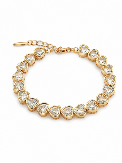 Gold-plated bracelet with crystal hearts on a white background