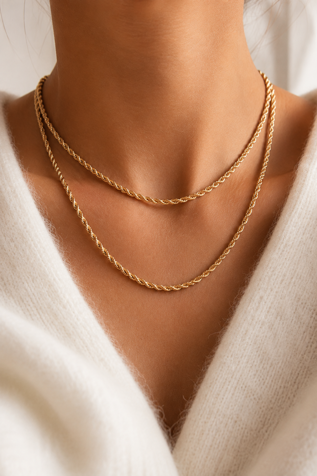 Gold-tone twisted rope chain necklace worn on the neck – lifestyle photo