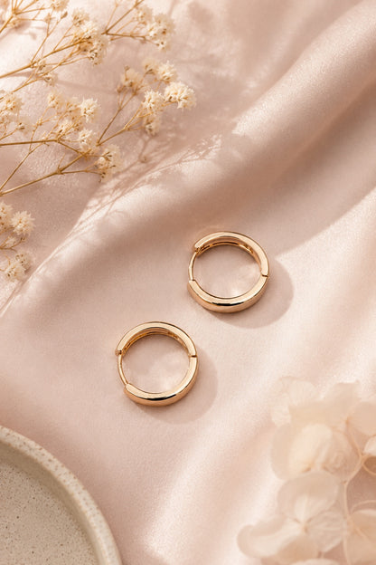 Vita 18k gold-plated classic hoop earrings 17 mm on pink fabric